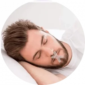 Male sleeping in his side with his mouth taped to prevent snoring.
